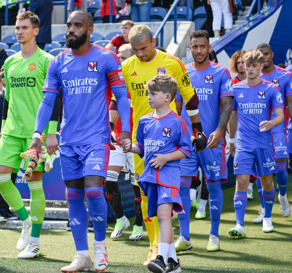 olympique lyon with the logo on the shorts during match game